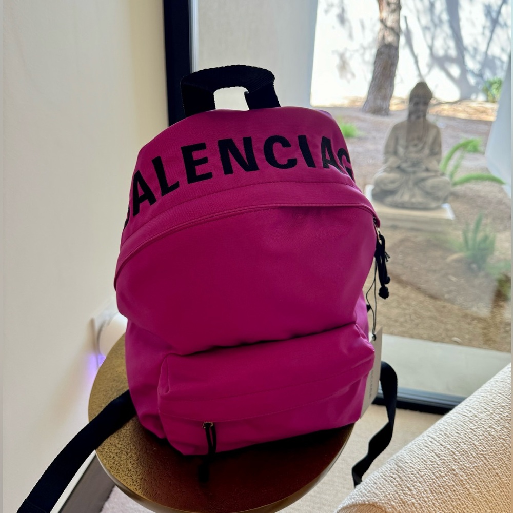 This is an NEW WITH TAGS authentic BALENCIAGA Nylon Wheel Logo Backpack.